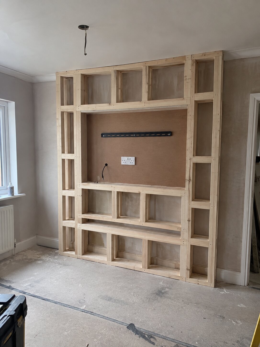 Full-height media wall with lit alcoves, Southport before