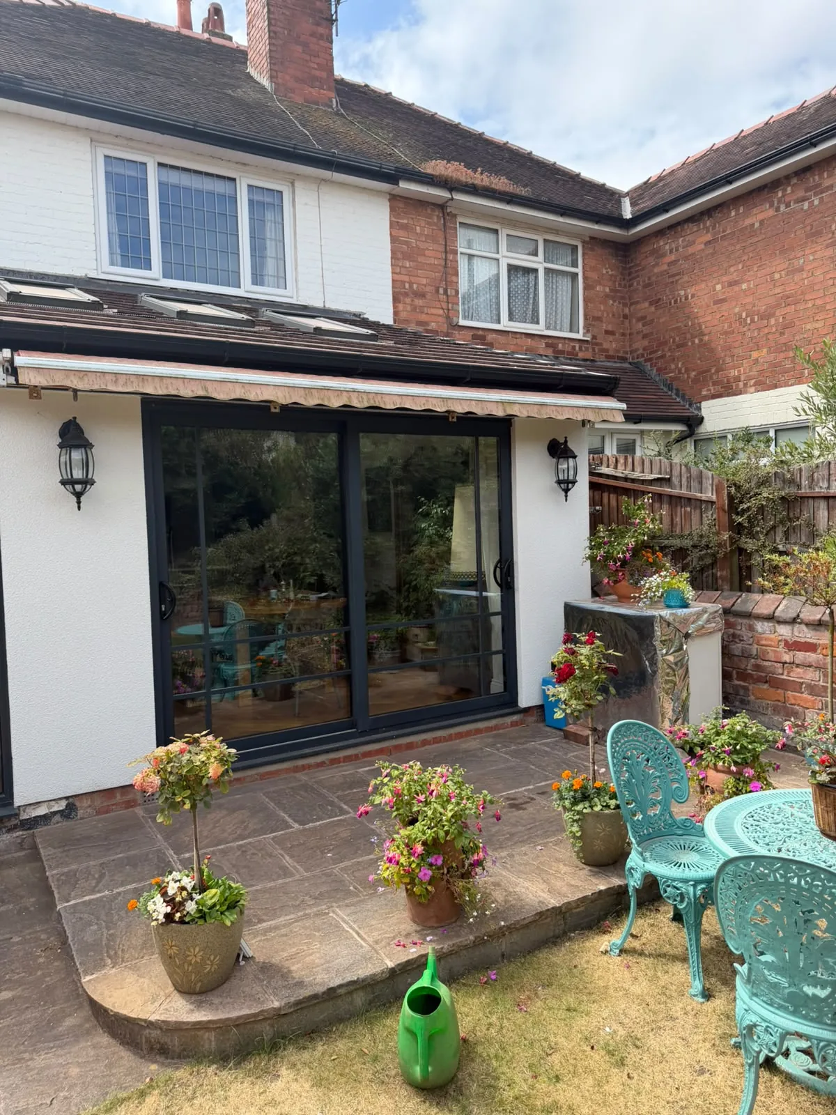 Rear elevation in Ormskirk with the ground floor rendered and the brick kept above