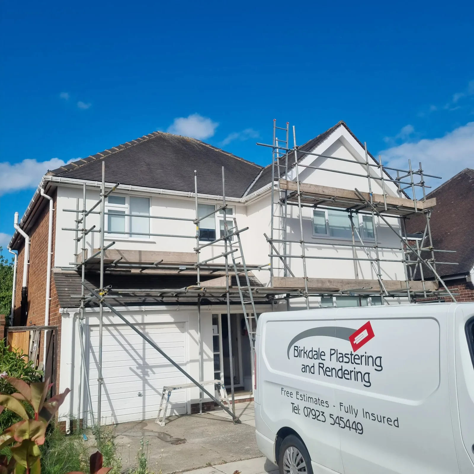 Finished white render with the Birkdale Plastering and Rendering van outside